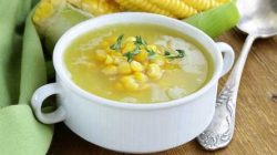 Soup Of Fresh Yellow Corn Served On A Wooden Table